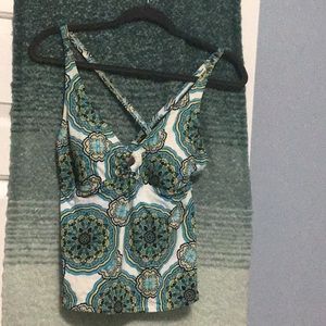 White background tanking with a beautiful cerulean design accented with gold.